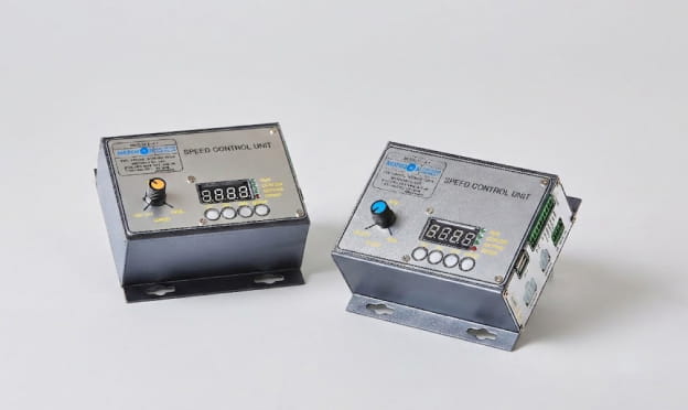 Speed control unit pair with digital displays and adjustment knobs for motor regulation